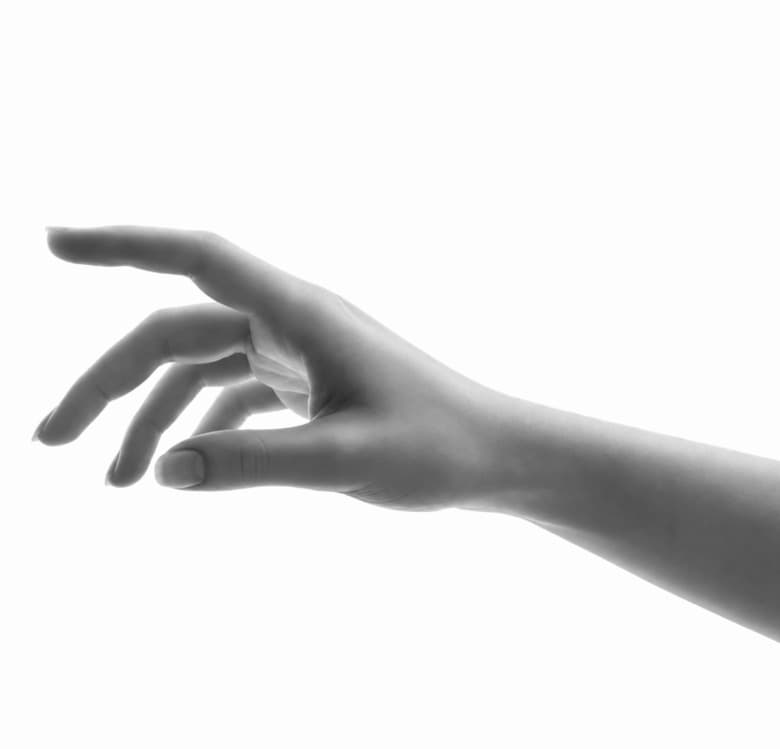 A human hand reaching toward the AI